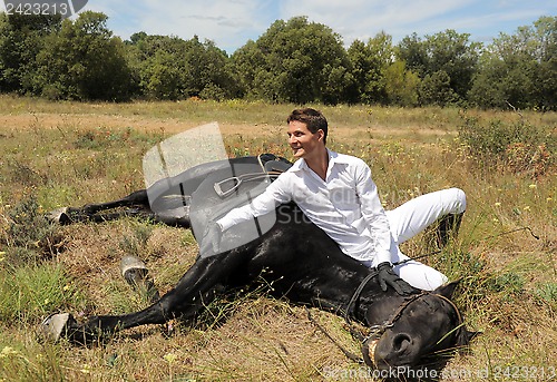 Image of young man and horse