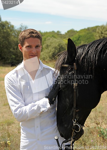 Image of young man and horse