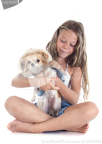 Image of child and chihuahua