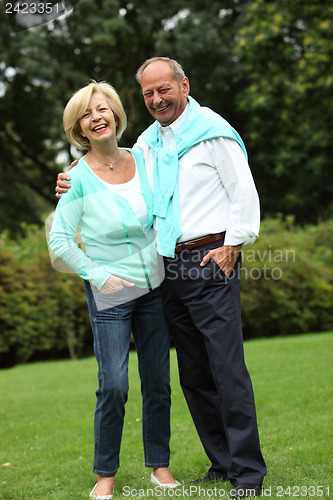 Image of Laughing relaxed elderly couple