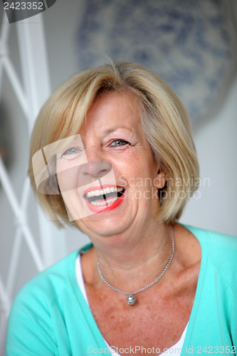 Image of Laughing vivacious senior woman