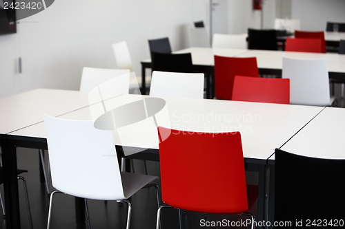 Image of Empty red and white tables and chairs