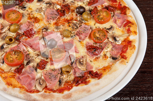 Image of pizza with ham and mushrooms
