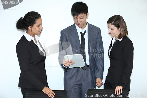 Image of Multiethnic coworkers discussing a problem