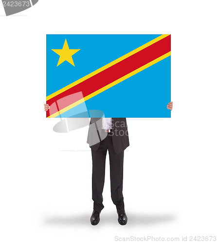 Image of Businessman holding a big card, flag of Congo