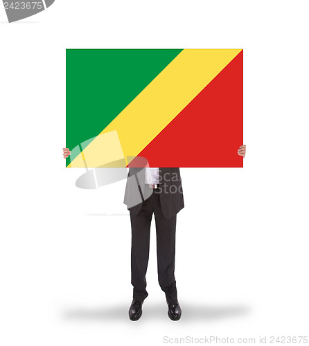 Image of Businessman holding a big card, flag of Congo