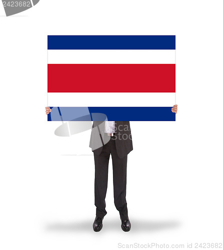 Image of Businessman holding a big card, flag of Costa RIca