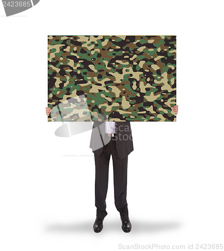 Image of Businessman holding a big card, camouflage 