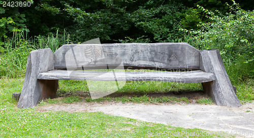 Image of Sitting wooden bench in the woods