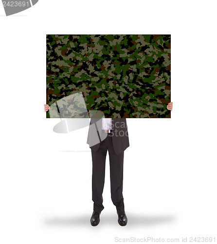 Image of Businessman holding a big card, camouflage 