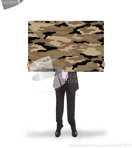 Image of Businessman holding a big card, camouflage 