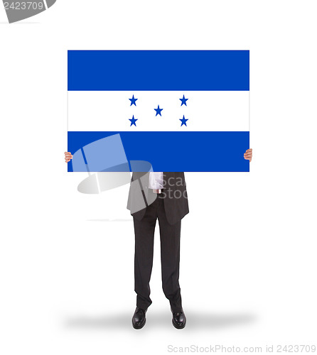 Image of Businessman holding a big card, flag of Honduras