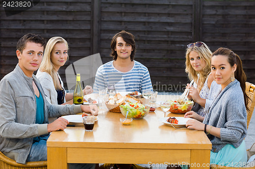 Image of Friends Enjoying Meal At Outdoor Party