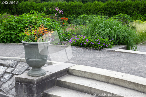 Image of Flowers decorating stone steps in the garden