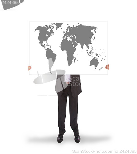 Image of Businessman holding a big card, world map