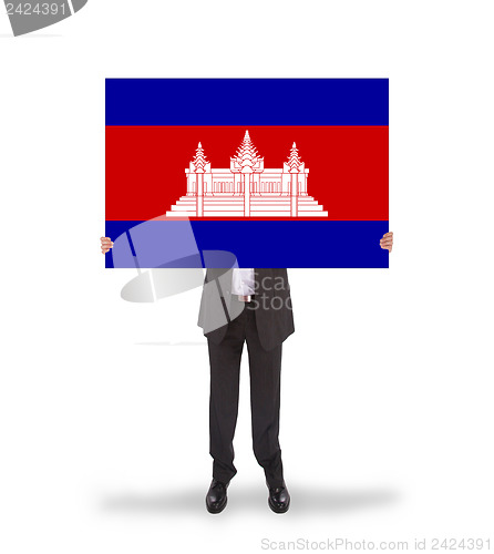 Image of Businessman holding a big card, flag of Cambodia