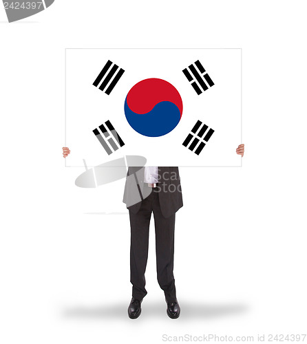 Image of Businessman holding a big card, flag of South Korea