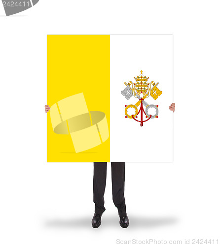 Image of Businessman holding a big card, flag of Vatican City