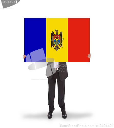 Image of Businessman holding a big card, flag of Moldova