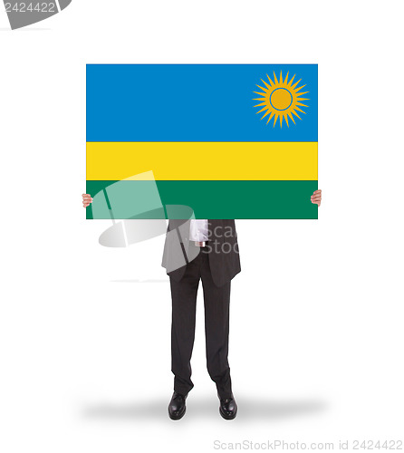 Image of Businessman holding a big card, flag of Rwanda