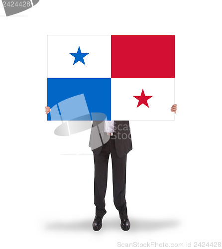 Image of Businessman holding a big card, flag of Panama