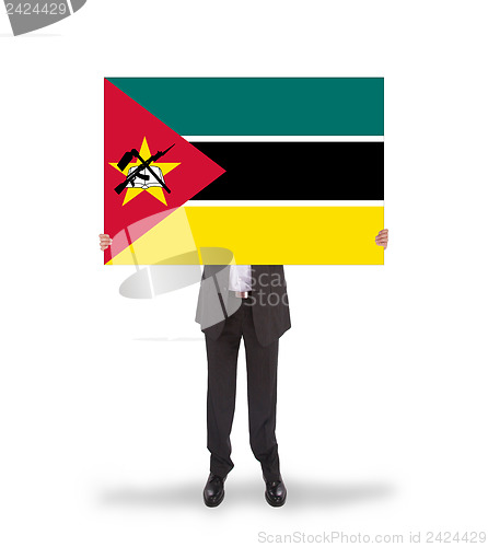 Image of Businessman holding a big card, flag of Mozambique