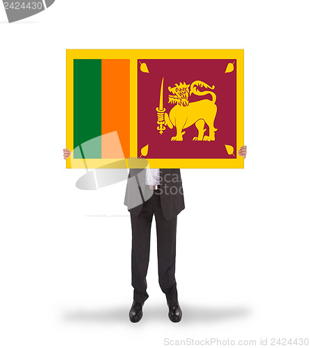 Image of Businessman holding a big card, flag of Sri Lanka