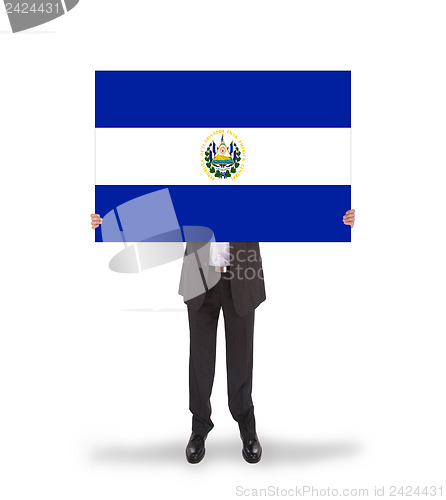 Image of Businessman holding a big card, flag of El Salvador