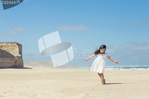 Image of Girl dancing on the beach