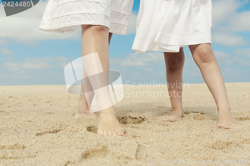 Image of Woman and her daughter on the beach