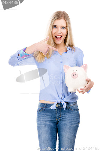 Image of Woman pointing to a piggy bank