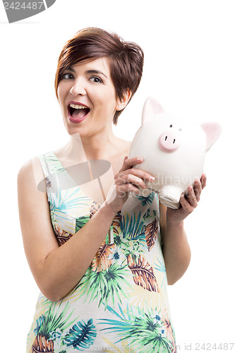 Image of Admired woman with a piggy bank