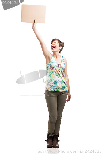 Image of Happy woman holding with a cardboard