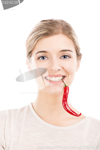Image of Beautiful woman holding a red chilli pepper