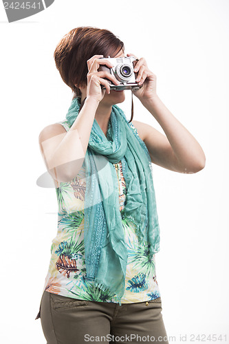 Image of Woman taking a photo with a vintage camera