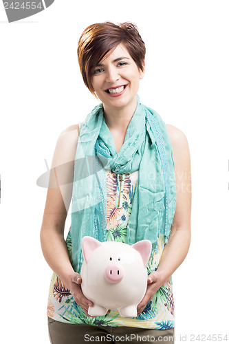 Image of Happy woman with a piggy bank