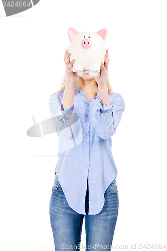 Image of Beautiful woman holding  a piggy bank