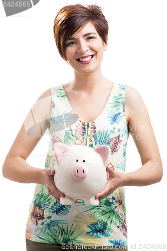 Image of Happy woman with a piggy bank