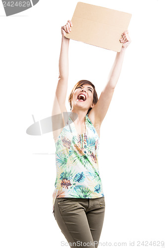 Image of Happy woman holding with a cardboard