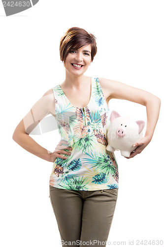 Image of Beautiful woman holding a piggybank