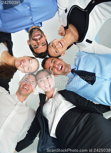 Image of business people with their heads together