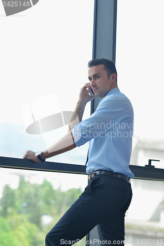 Image of business man talking by cellphone
