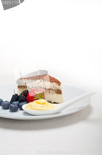 Image of tiramisu dessert with berries and cream