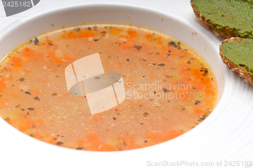 Image of Italian minestrone soup with pesto crostini on side