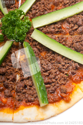 Image of Turkish beef pizza with cucumber on top