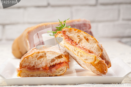 Image of ciabatta panini sandwich with parma ham and tomato