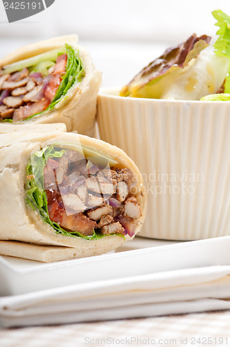 Image of kafta shawarma chicken pita wrap roll sandwich