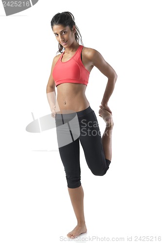 Image of fit woman stretching on white