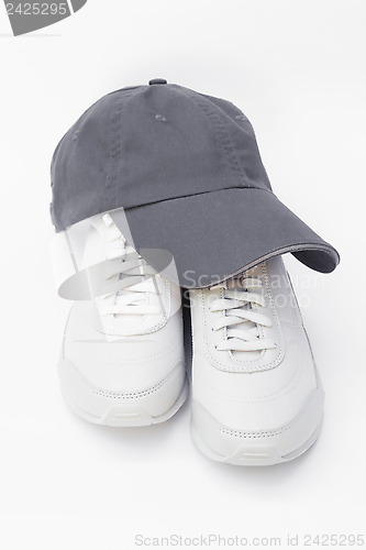 Image of Running shoes and baseball cap