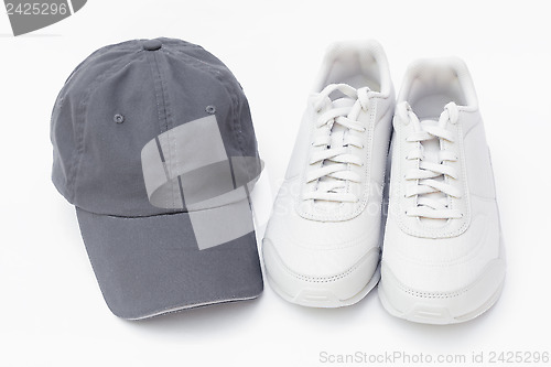 Image of Running shoes and baseball cap